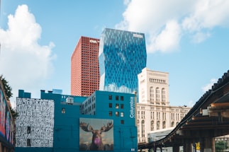 A colorful illustration of Chicago landmarks with children exploring and learning outdoors.