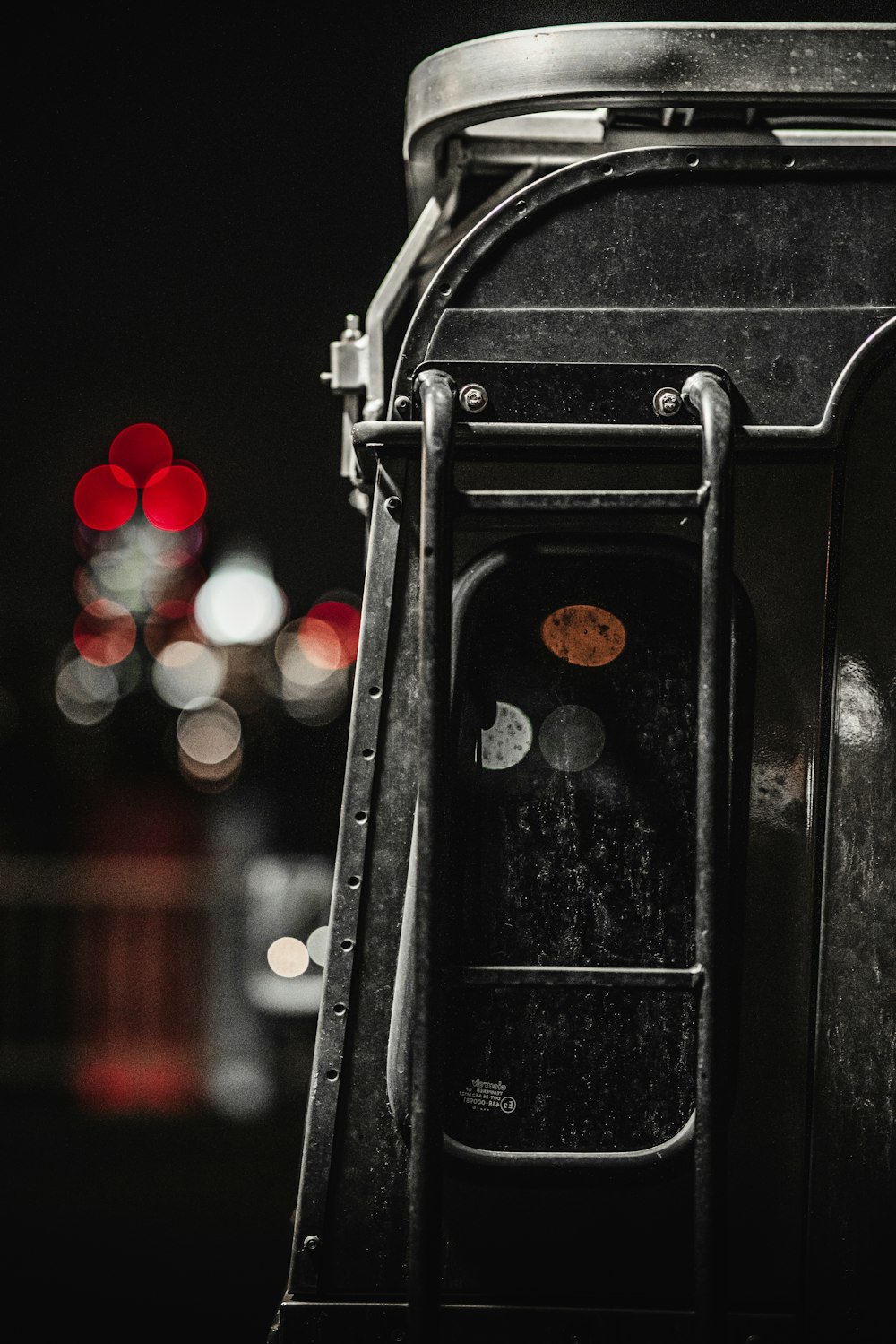 black train rail with red and white bokeh lights