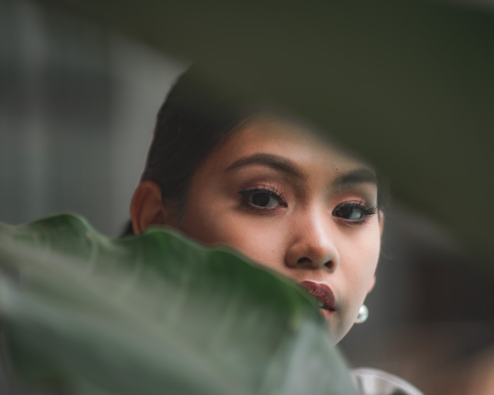 woman in green eyes in close up photography