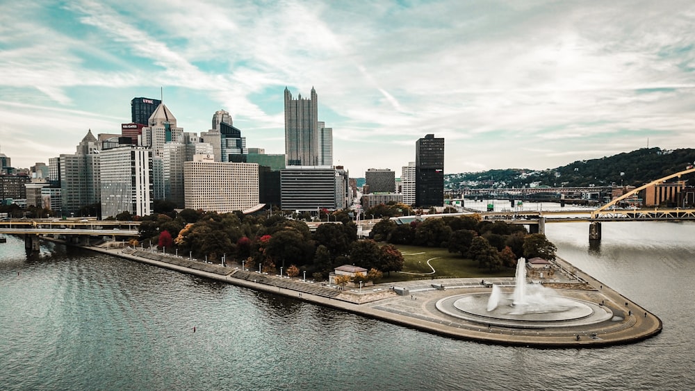 city skyline across body of water during daytime