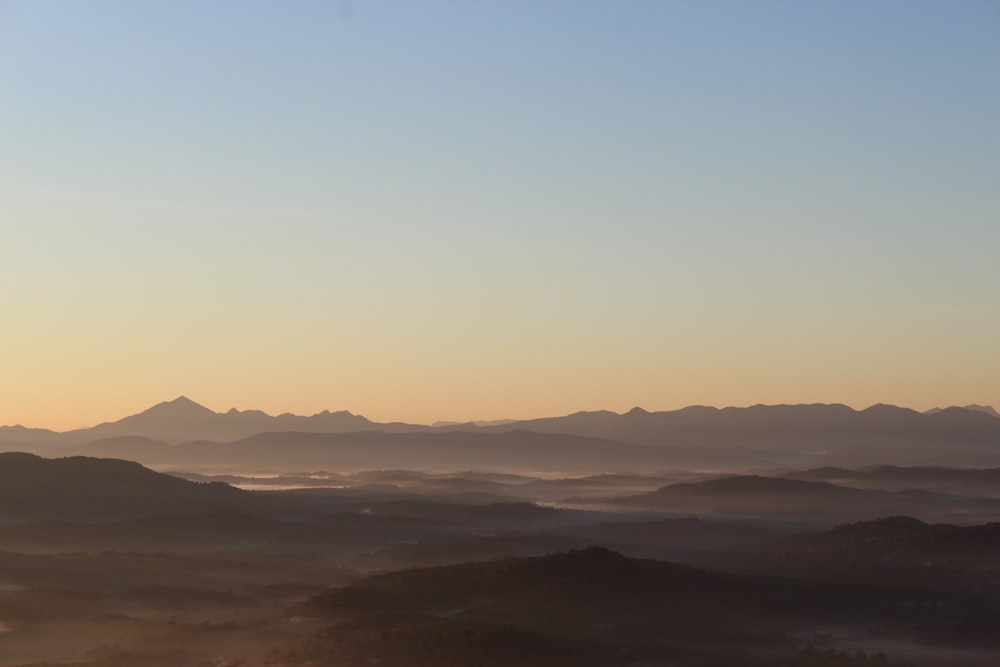 silhouette of mountains during sunset