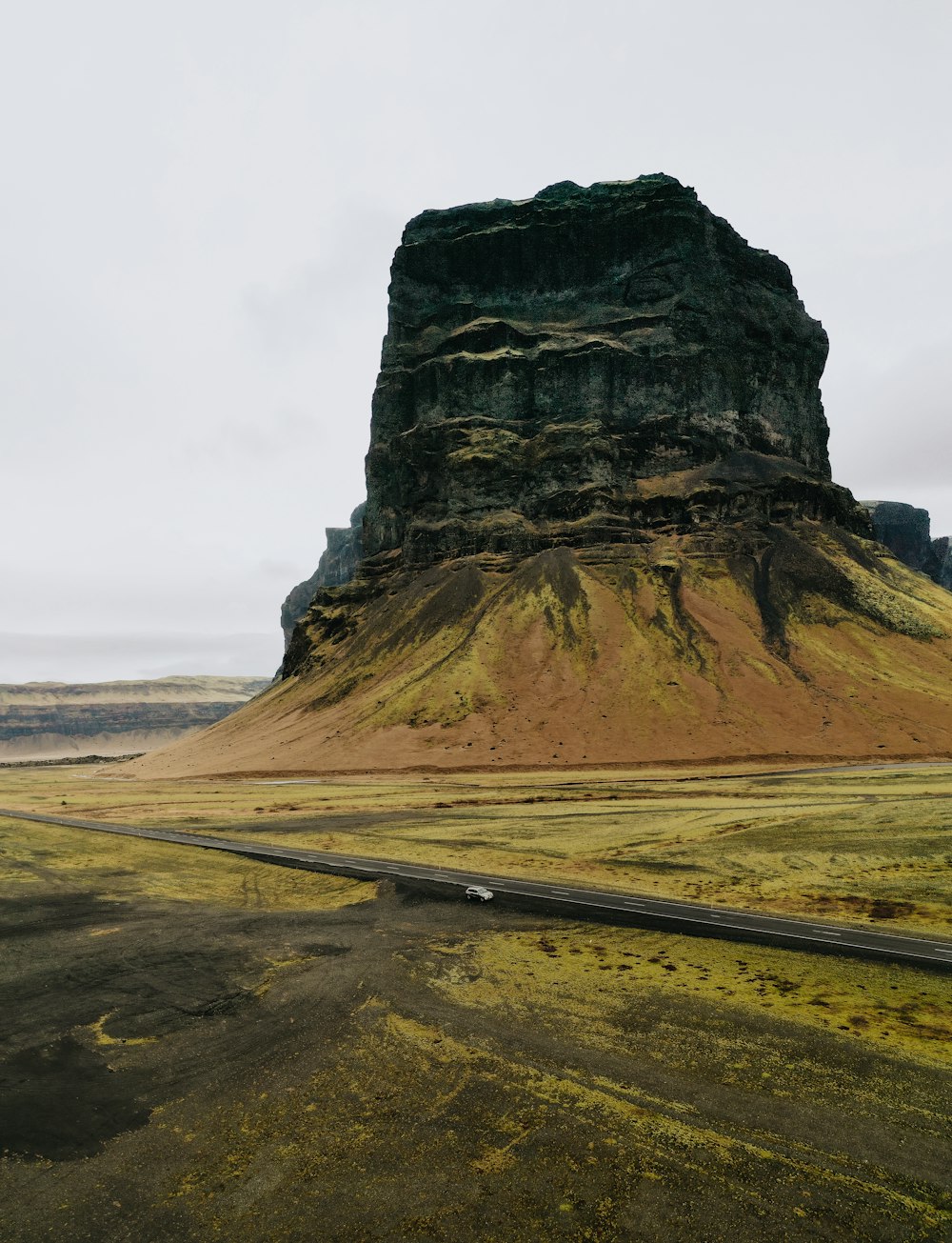 a mountain with a road going by it