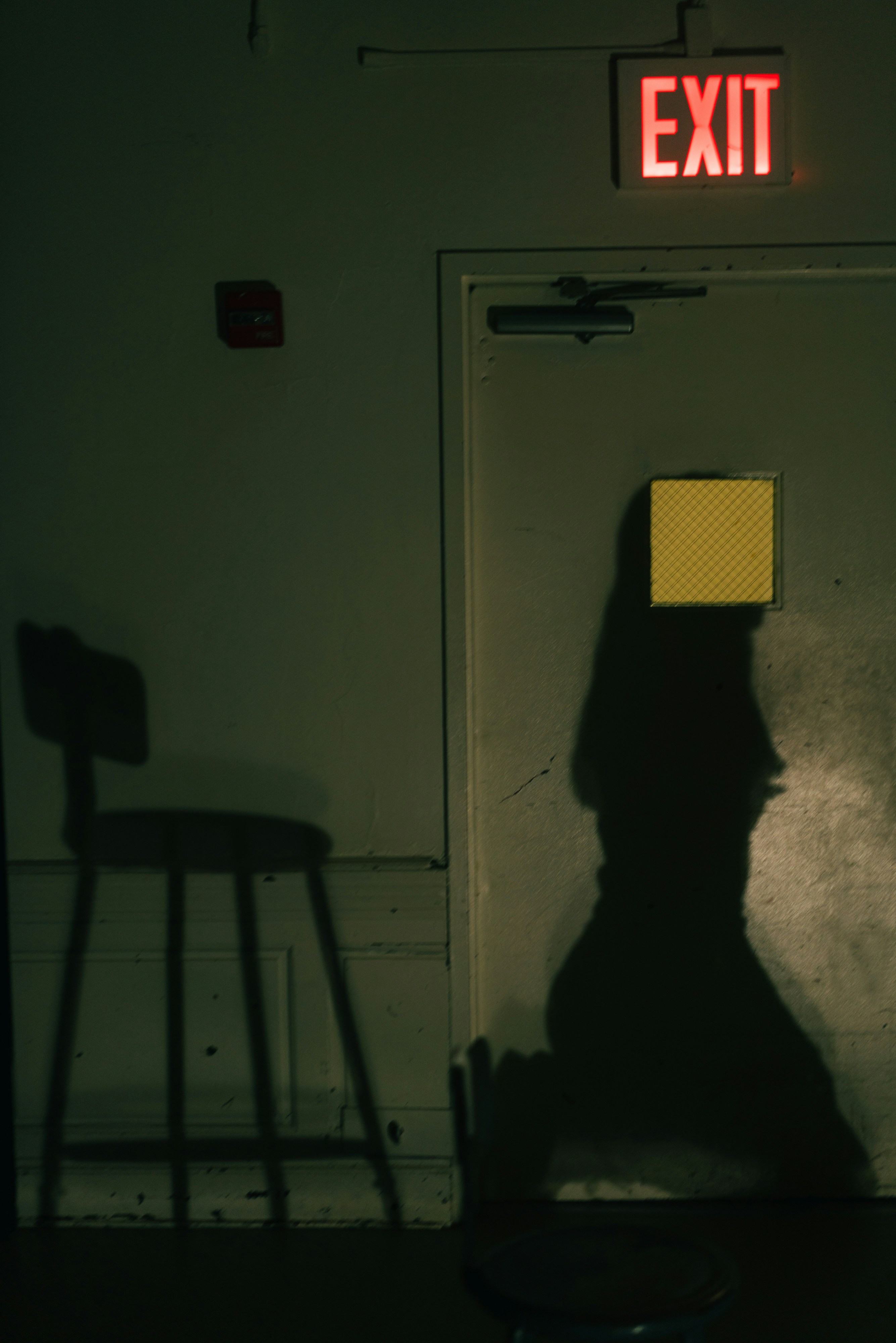 black and white chair beside white wooden door