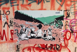 A work of street art featuring a group of cartoon animals and a child sitting on the ground, gazing toward an industrial landscape with an alien spaceship overhead. Surrounding the scene is a backdrop of graffiti with red and purple spray paint, including images of faces and abstract designs.