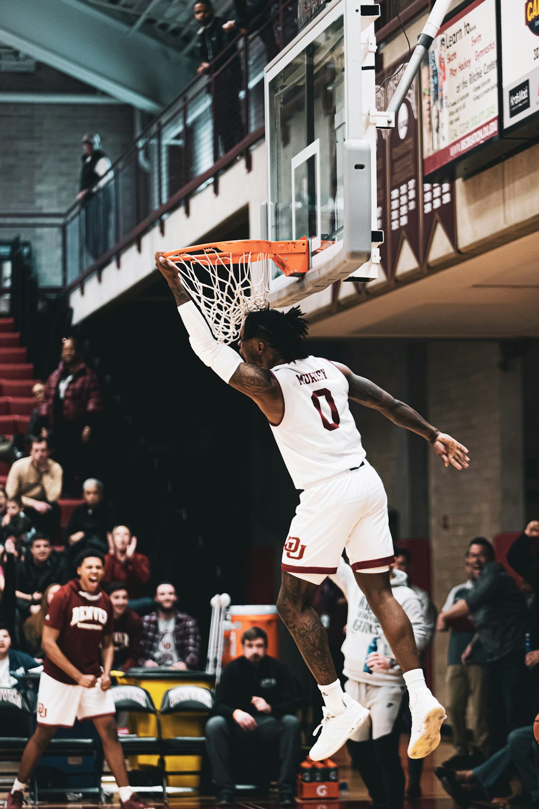 man in white jersey shirt playing basketball