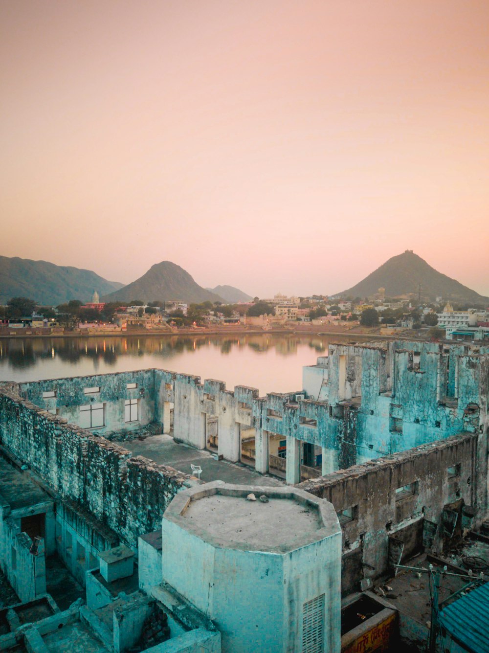 white and brown concrete buildings near body of water during daytime