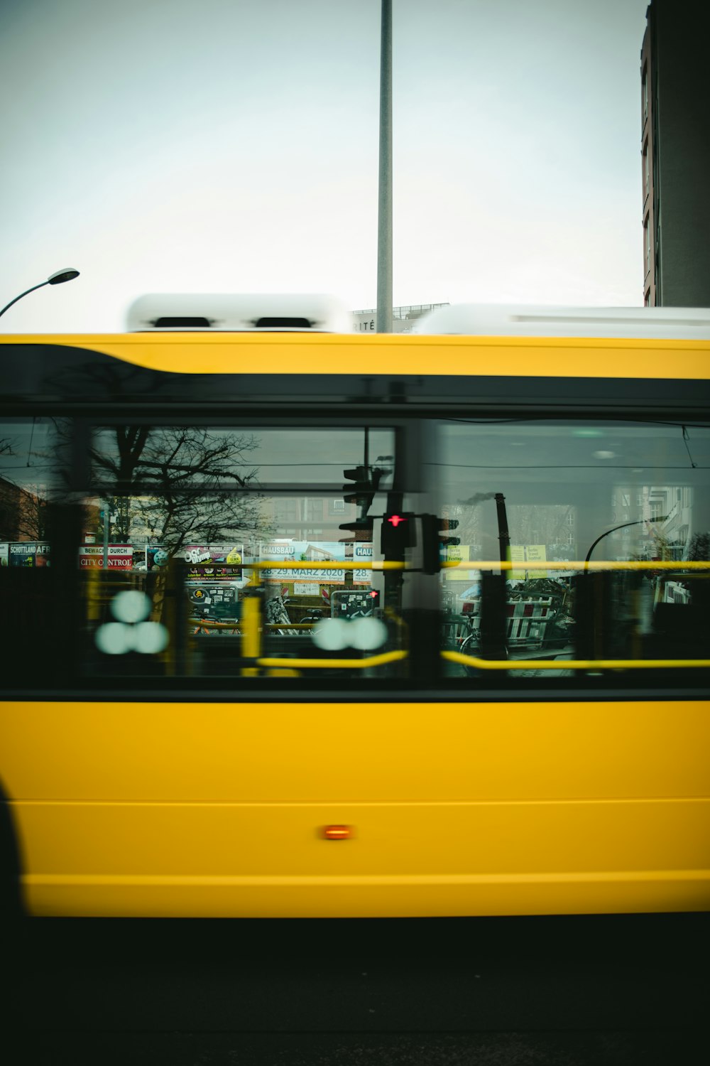 yellow and white bus with people inside