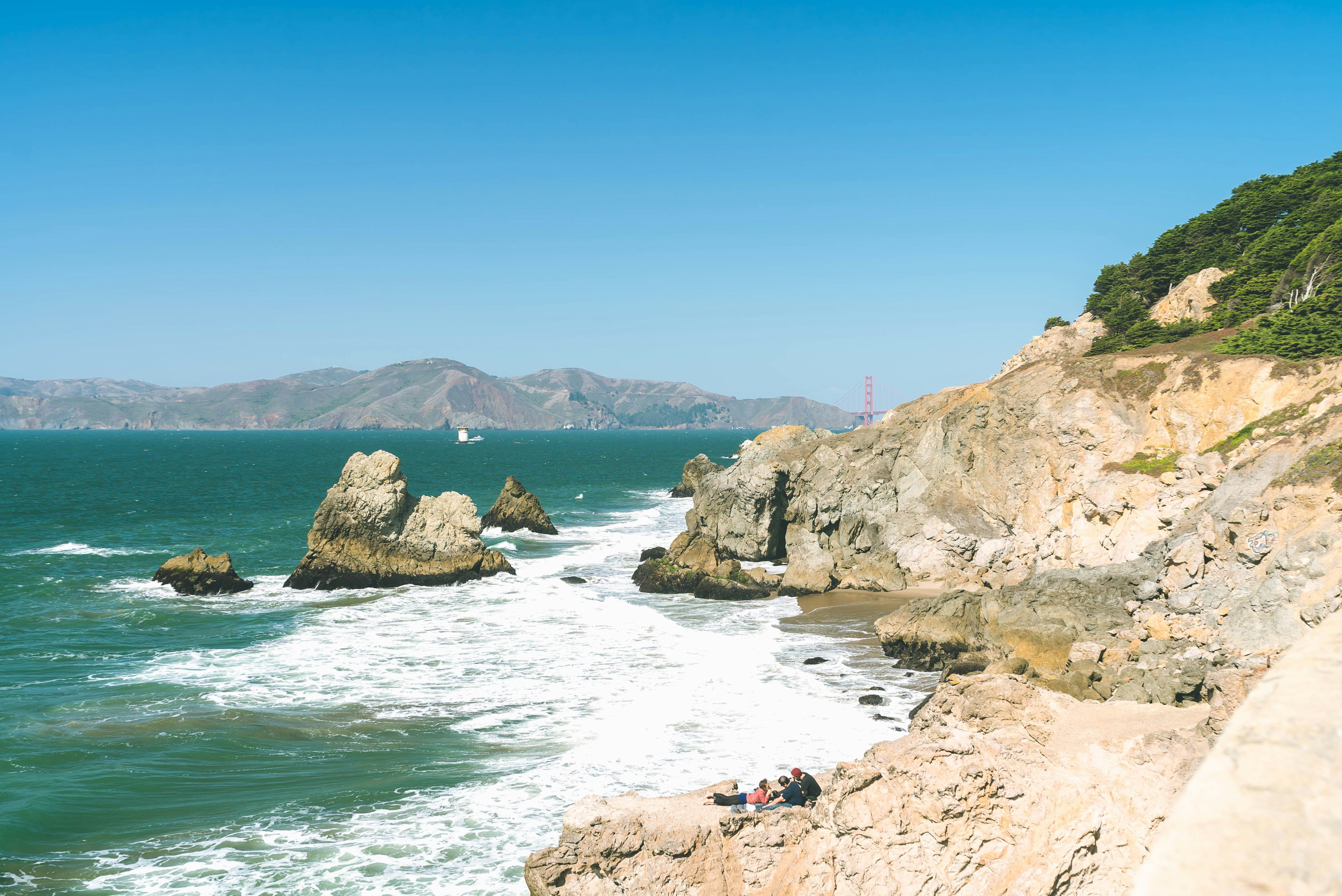 brown rock formation on sea during daytime