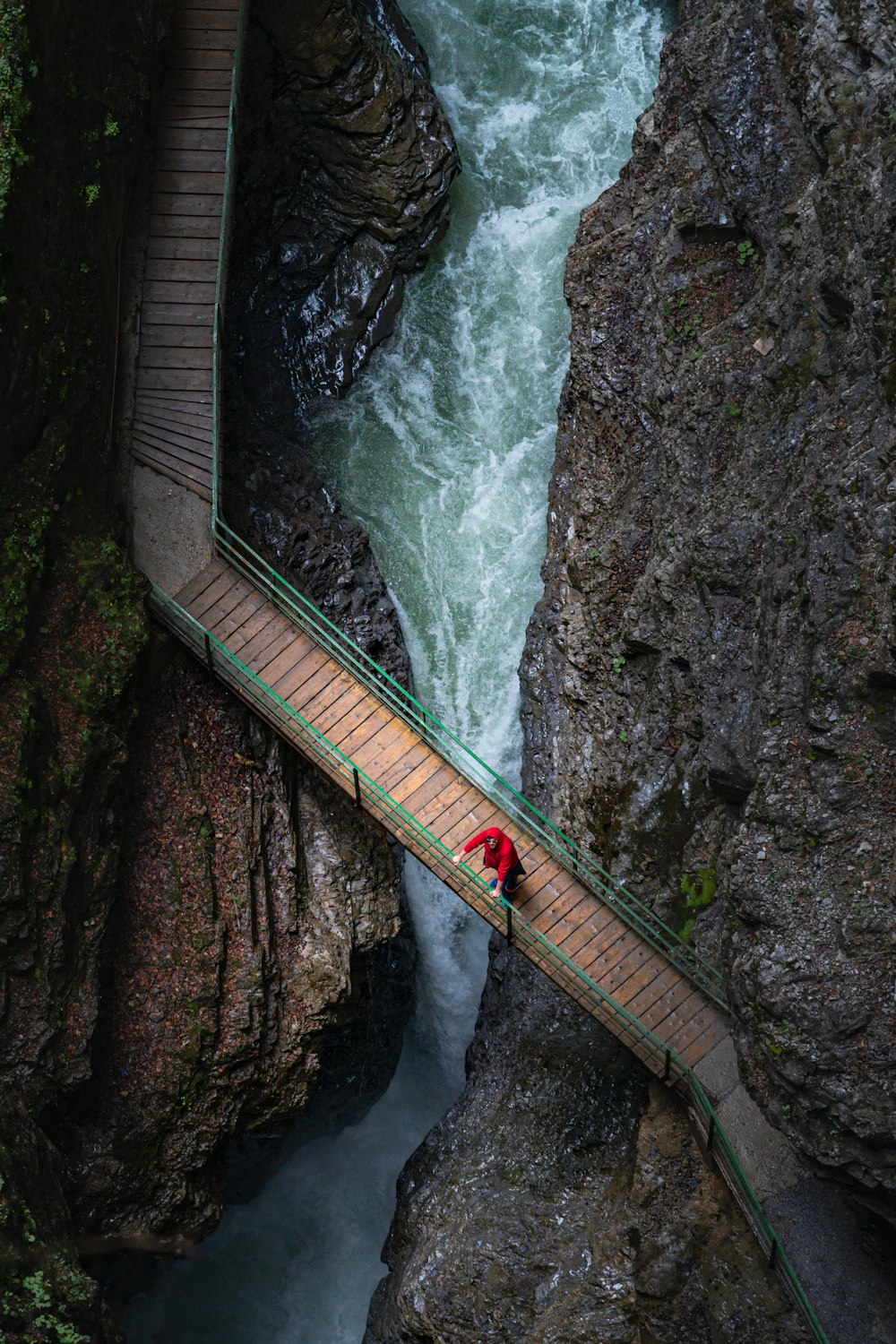 brown wooden bridge over river