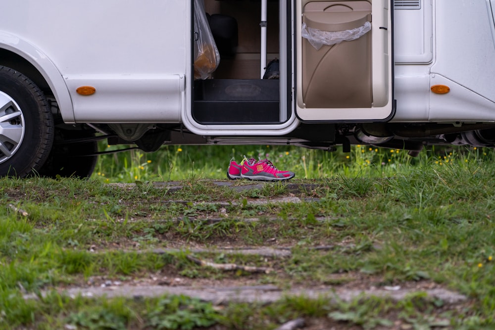 white and black van with purple flower on top