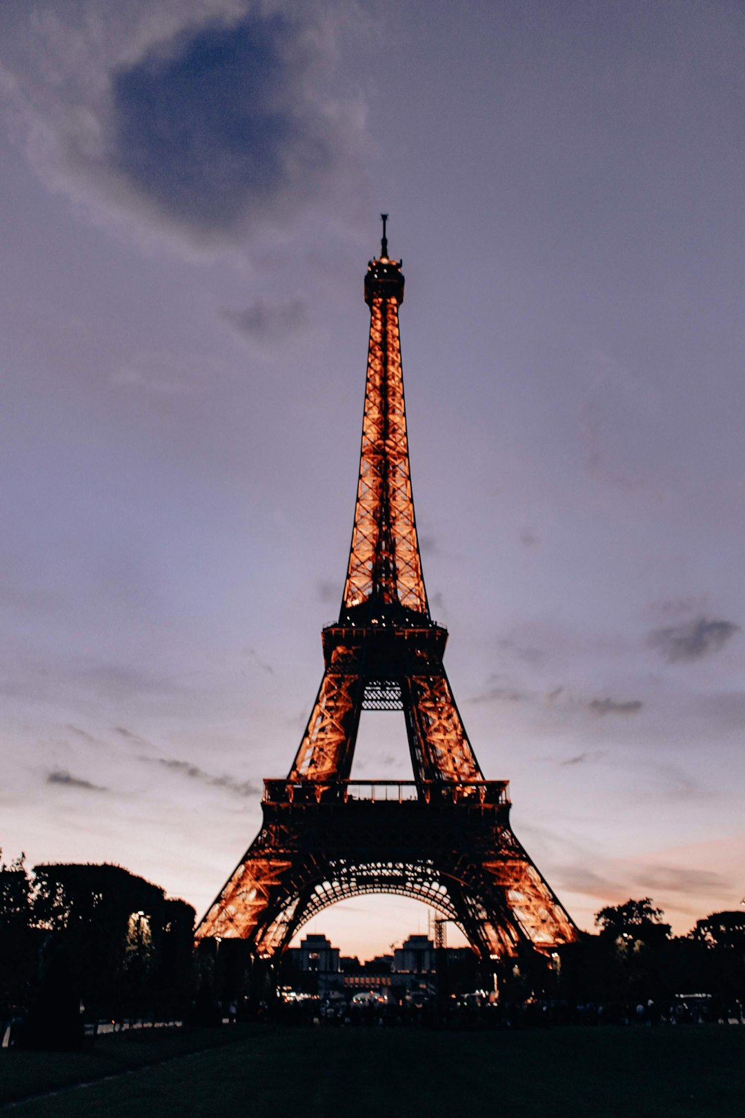 eiffel tower under gray cloudy sky