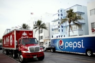 red and white ford truck on road during daytime