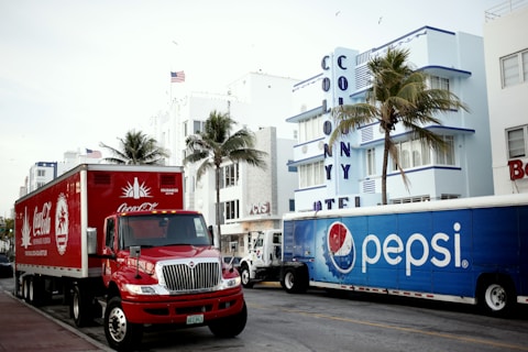 red and white ford truck on road during daytime
