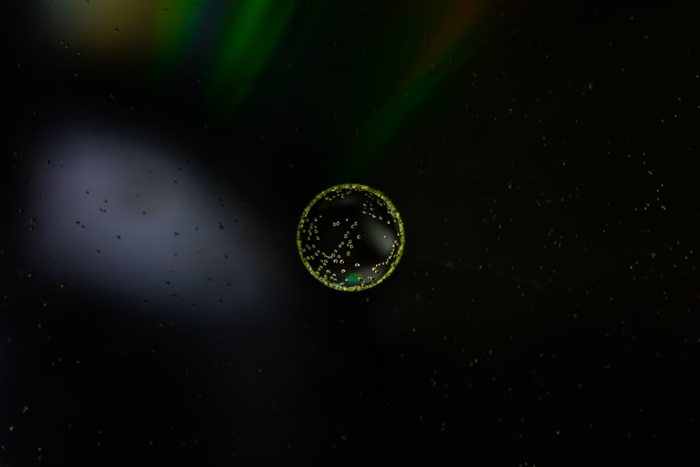 green and black planet with green and black background