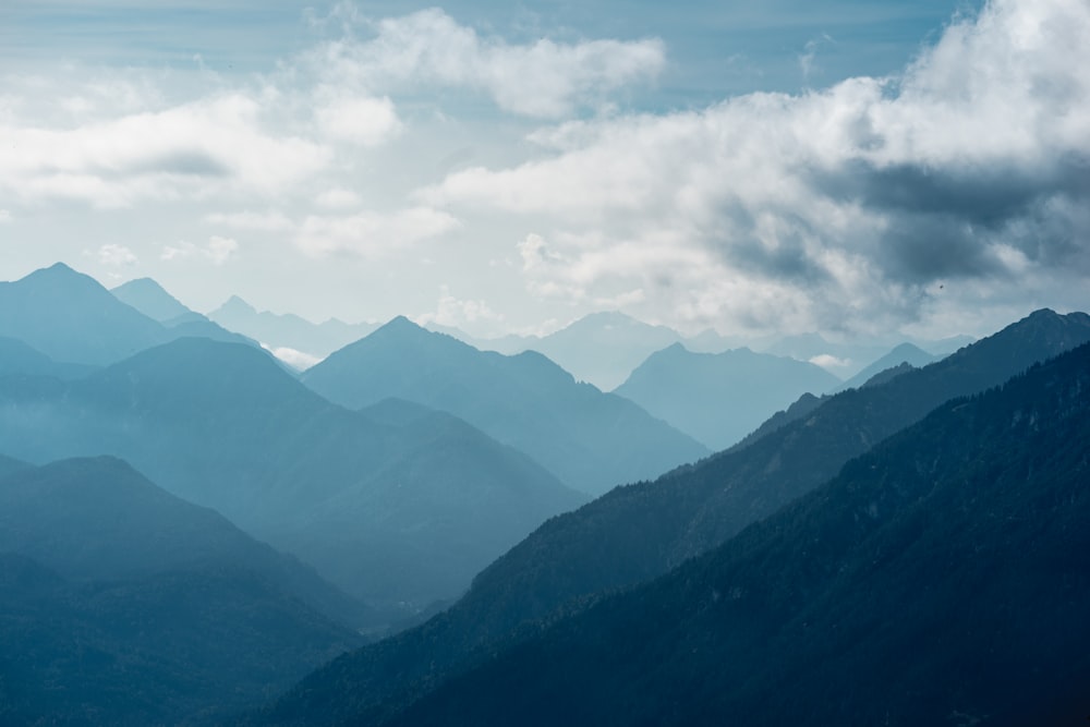 green mountains under white clouds during daytime