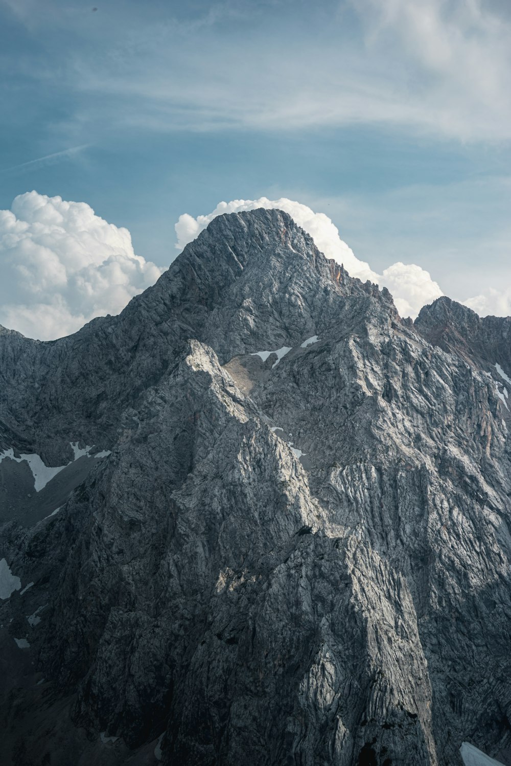 gray rocky mountain under blue sky during daytime