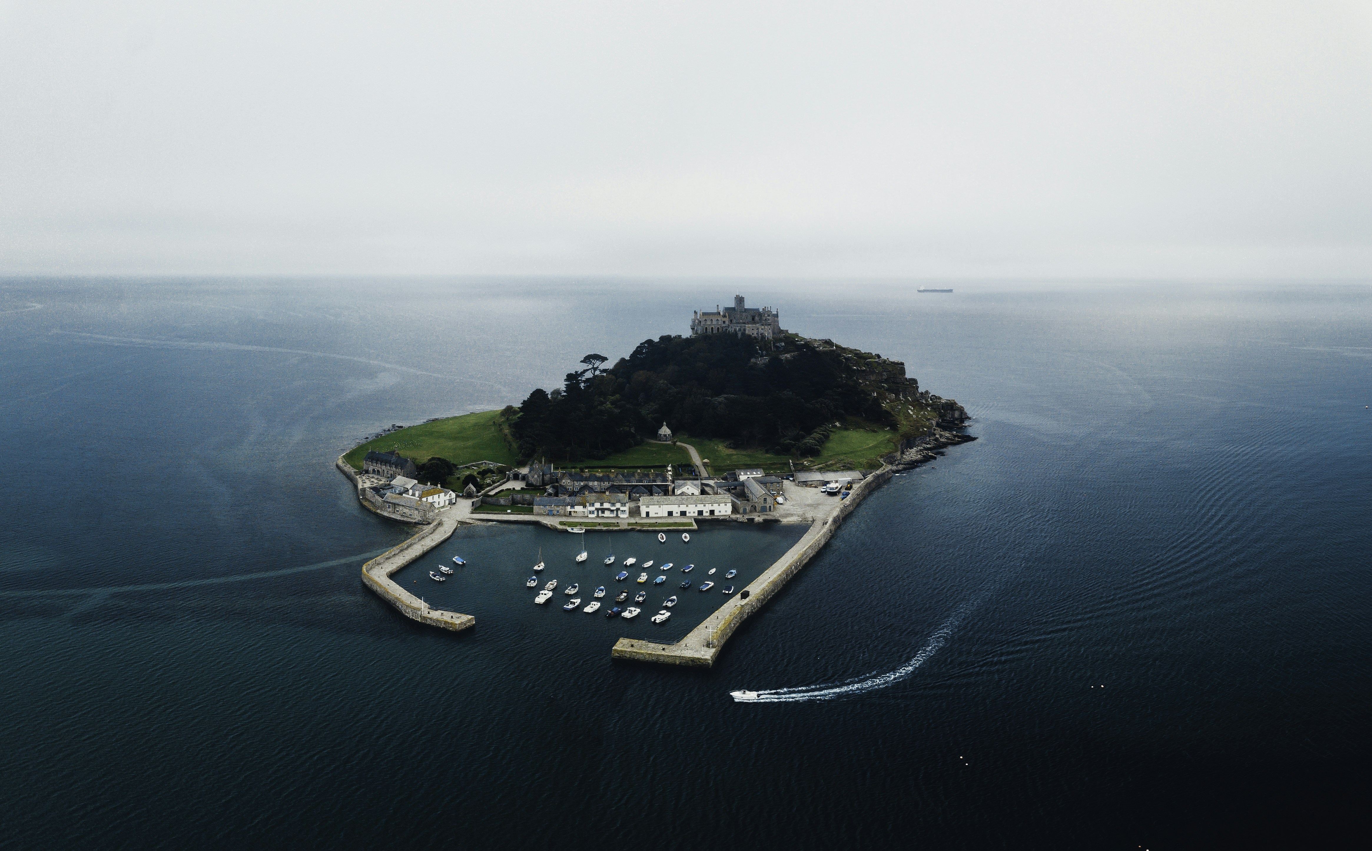 aerial view of city near body of water during daytime