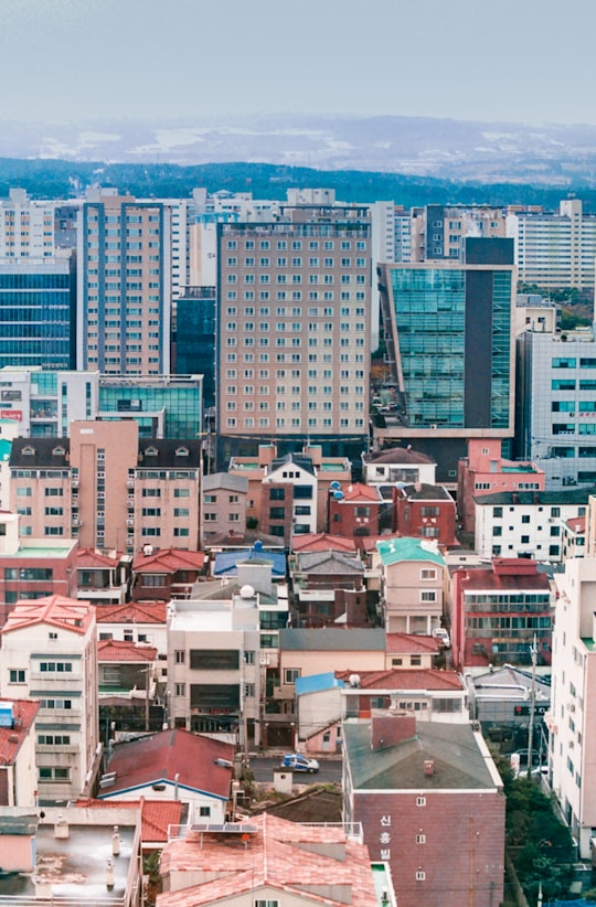 aerial view of city buildings during daytime in Jeju South Korea