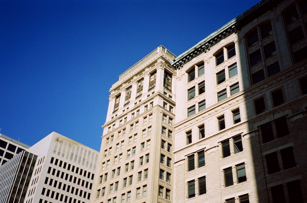 white concrete building under blue sky during daytime