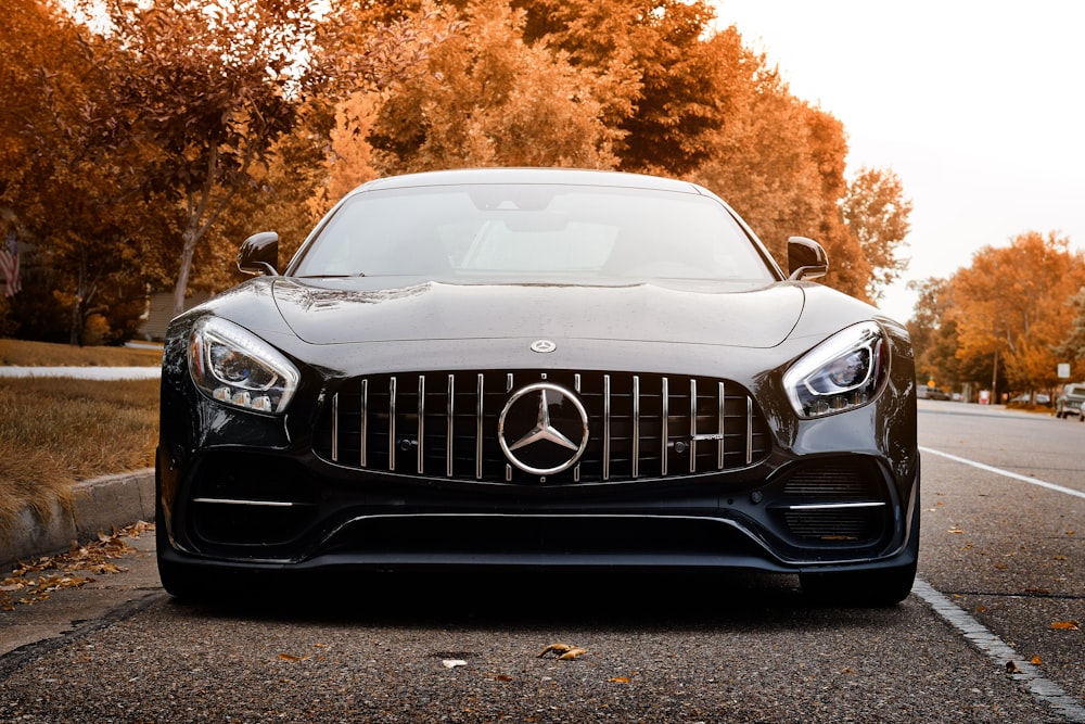 black mercedes benz car on road during daytime