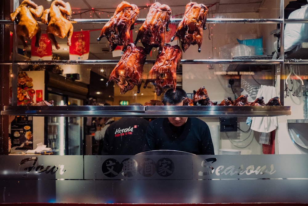 grilled meat on glass display counter