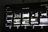 A vibrant, cinematic gallery interface resembling a streaming platform with colorful thumbnails.