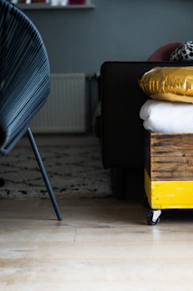 a stack of pillows sitting on top of a wooden crate