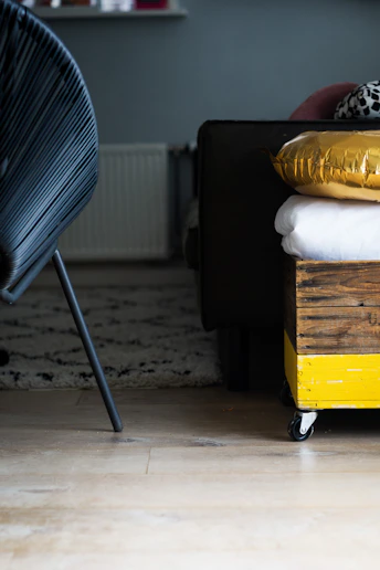 a stack of pillows sitting on top of a wooden crate
