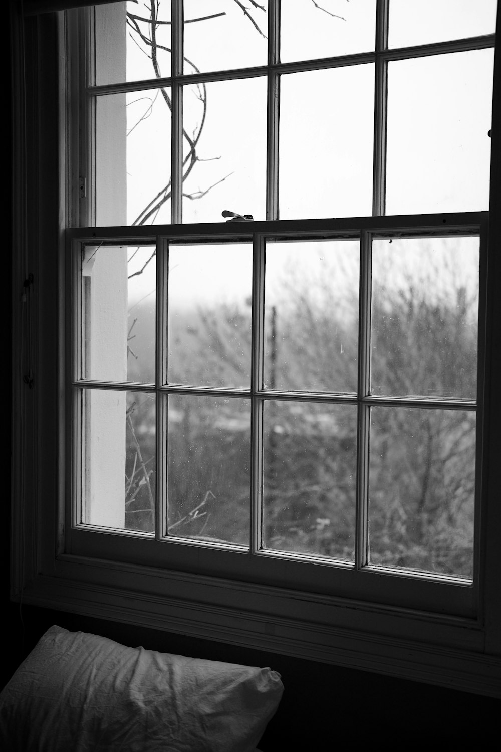 grayscale photo of glass window