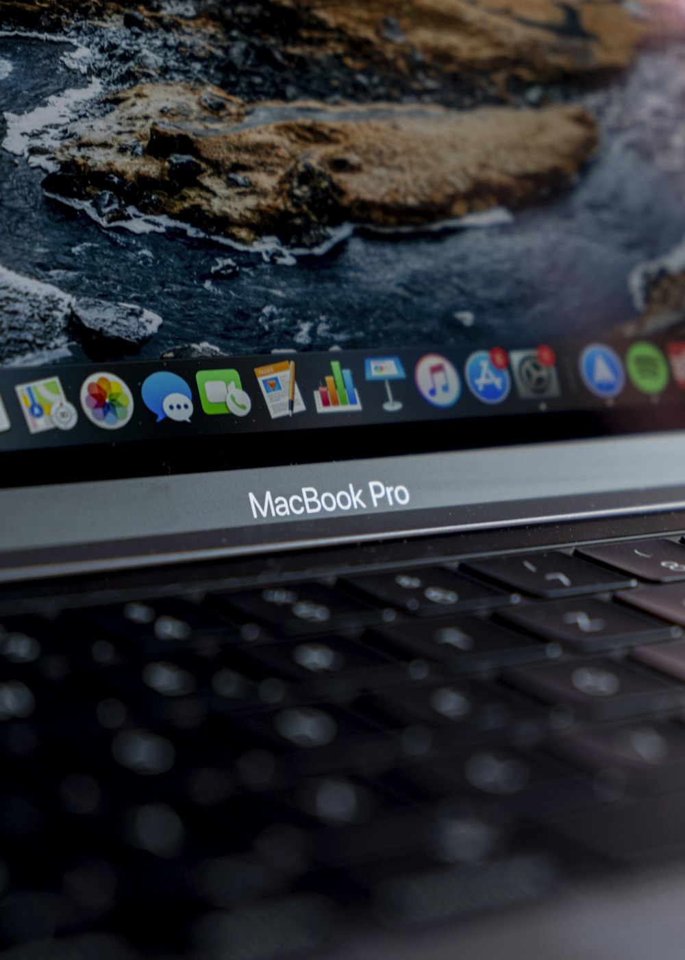 macbook pro displaying white and black rocks