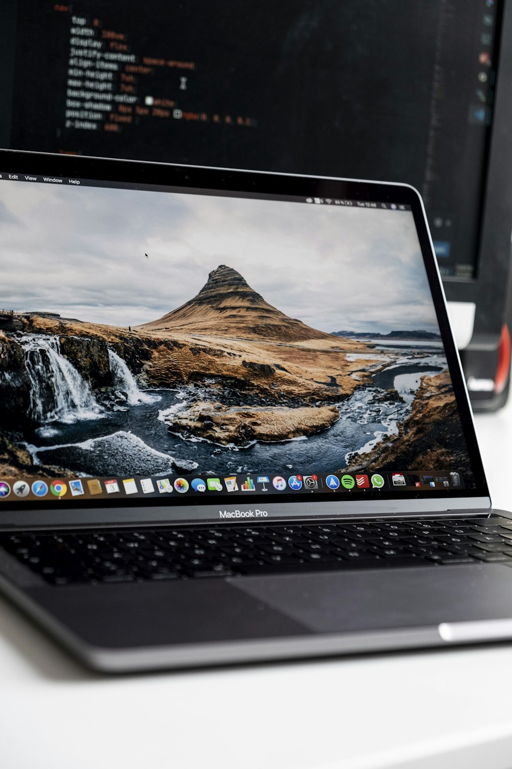 macbook pro displaying brown mountain