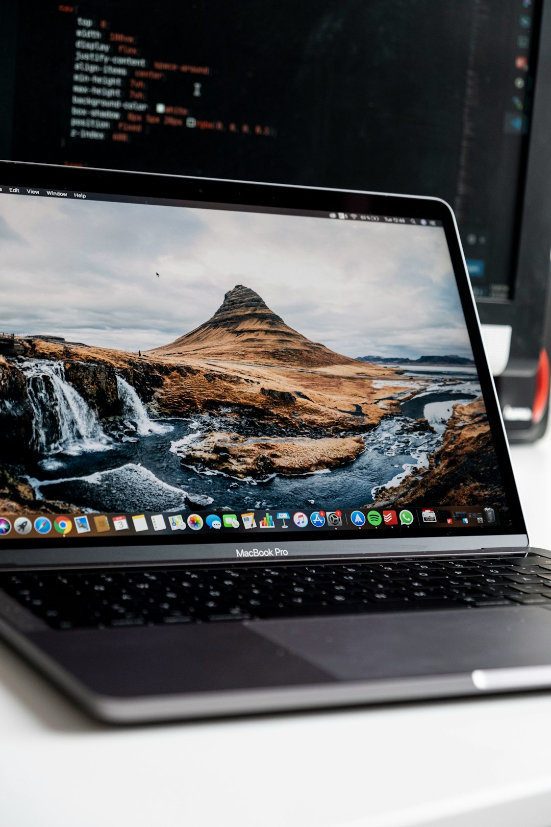 macbook pro displaying brown mountain