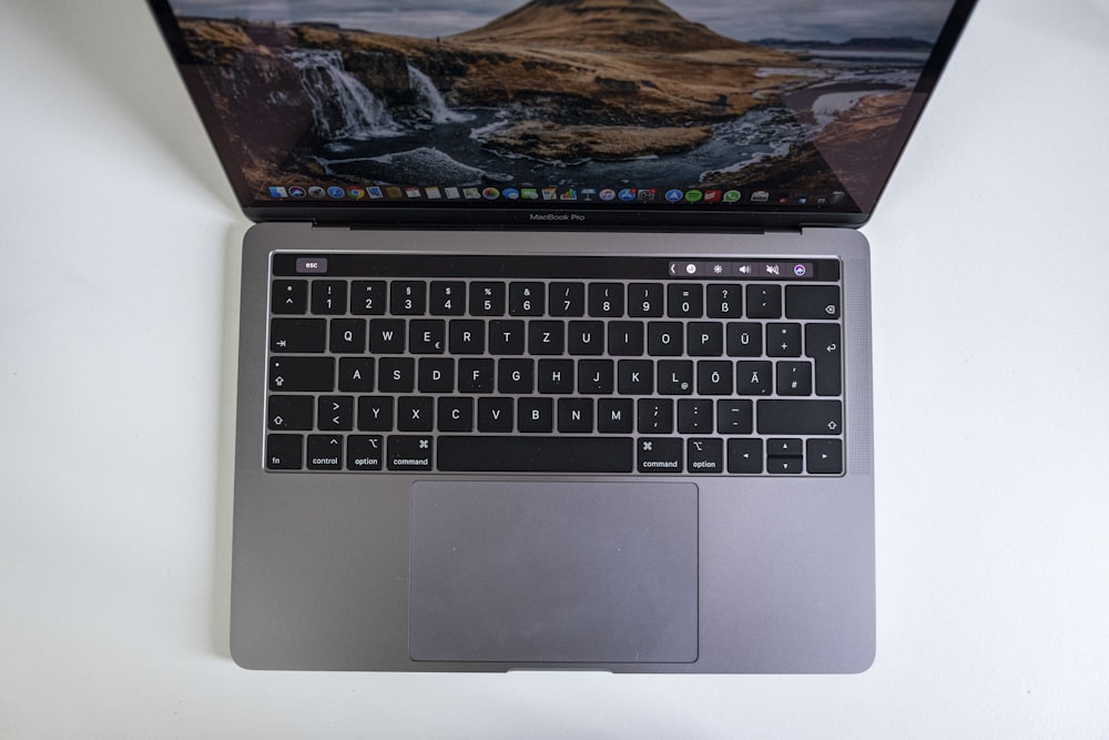 macbook pro on white table