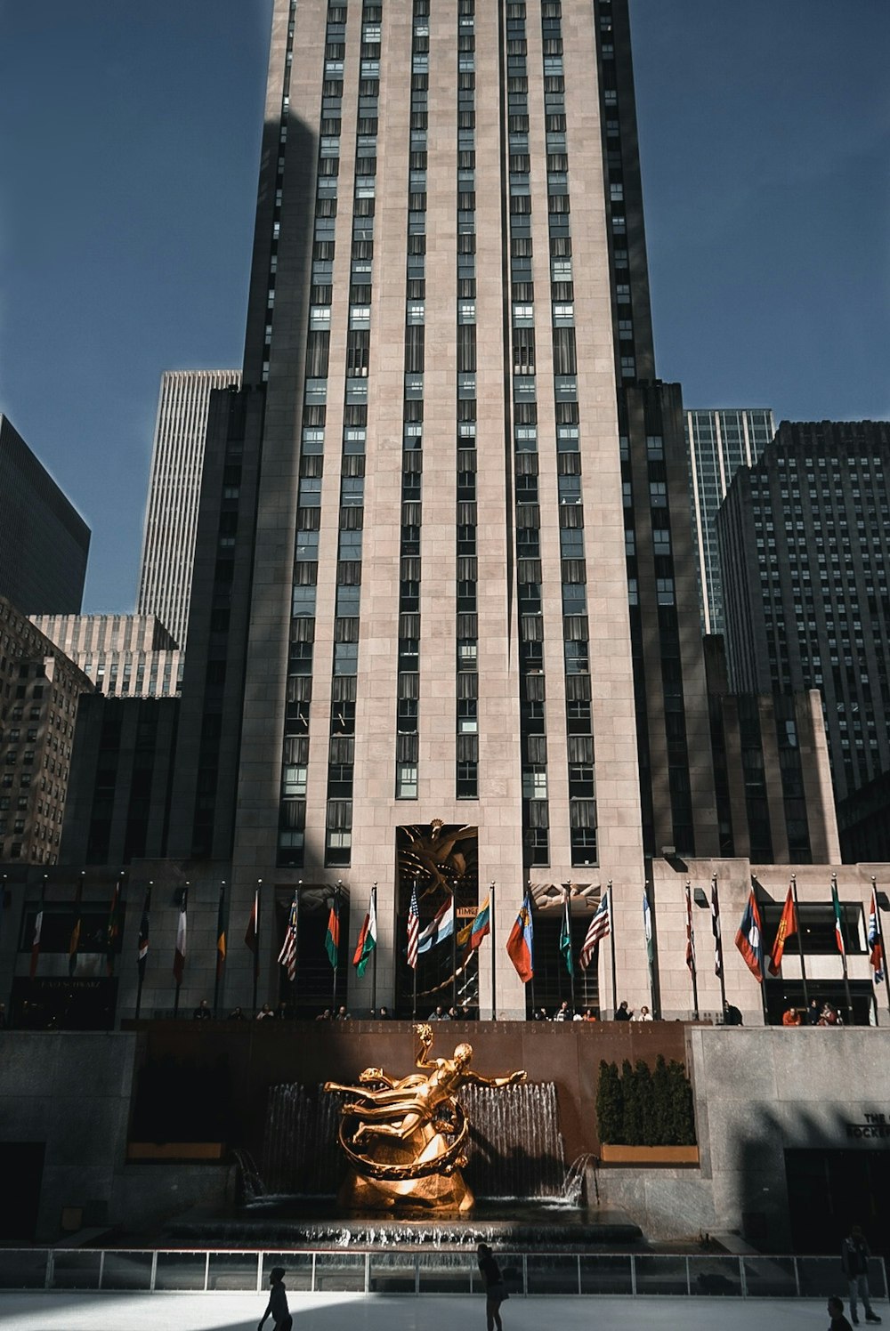 people standing near gray concrete building during daytime