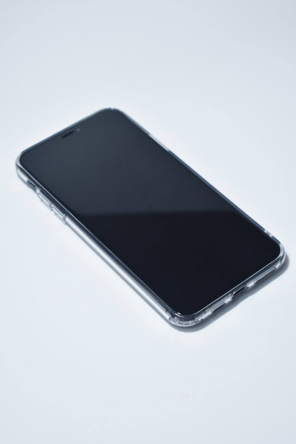 black android smartphone on white surface