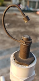 Close-up of a manual lever valve installed in an industrial pipeline