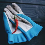 A lineup of sturdy safety gloves in various sizes and colors.