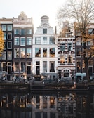 white concrete building near body of water during daytime
