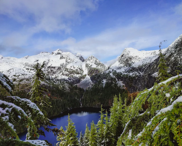 North Cascades alpine lake ringed by snow-covered peaks
