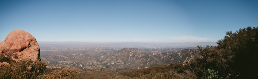 brown and green mountains under blue sky during daytime