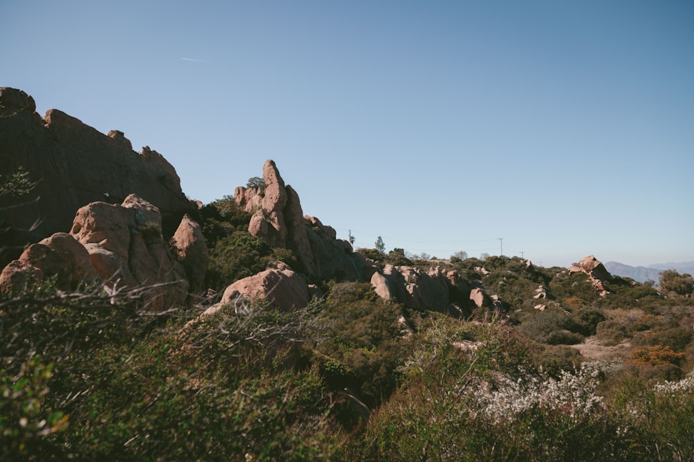 brown rock formation under blue sky during daytime