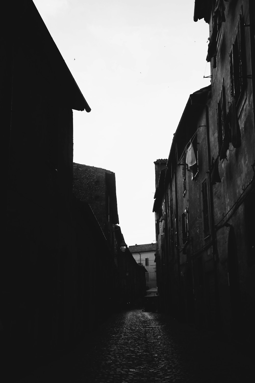 grayscale photo of concrete buildings