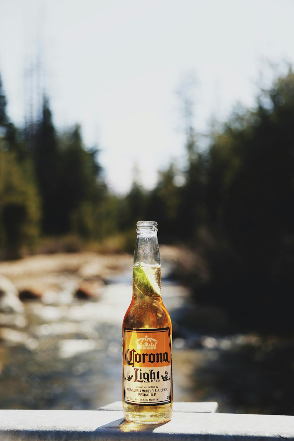 selective focus photography of UNK bottle on rock