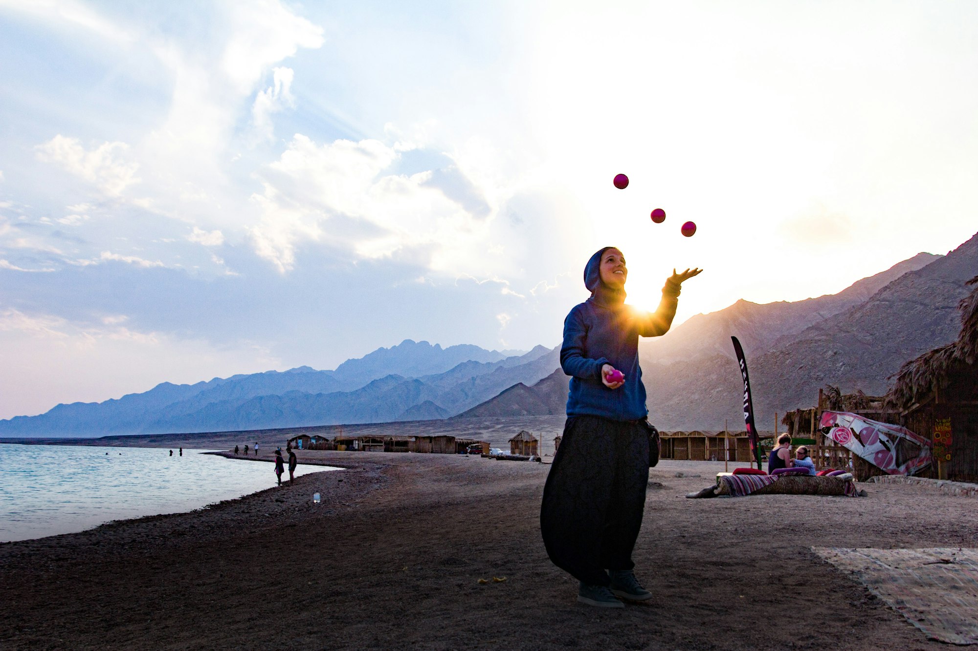 juggling girl in a beautiful landscape