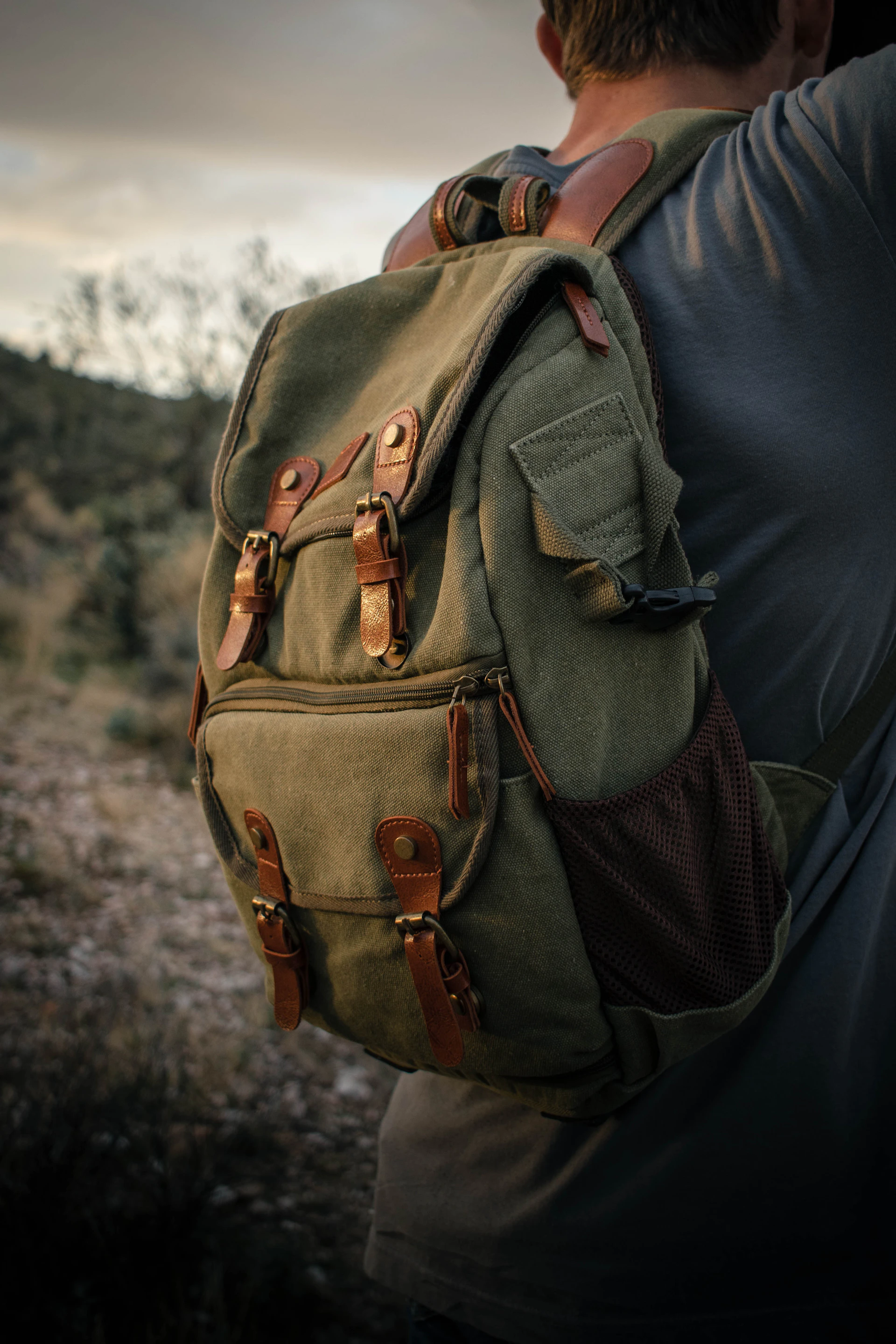 brown backpack on black textile