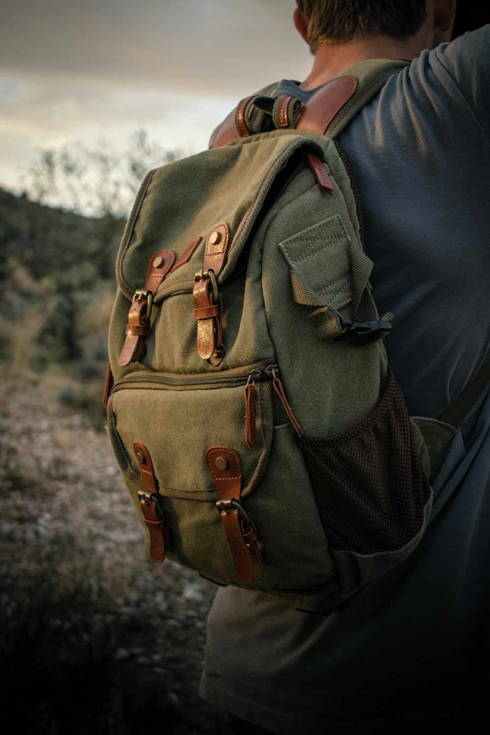 brown backpack on black textile