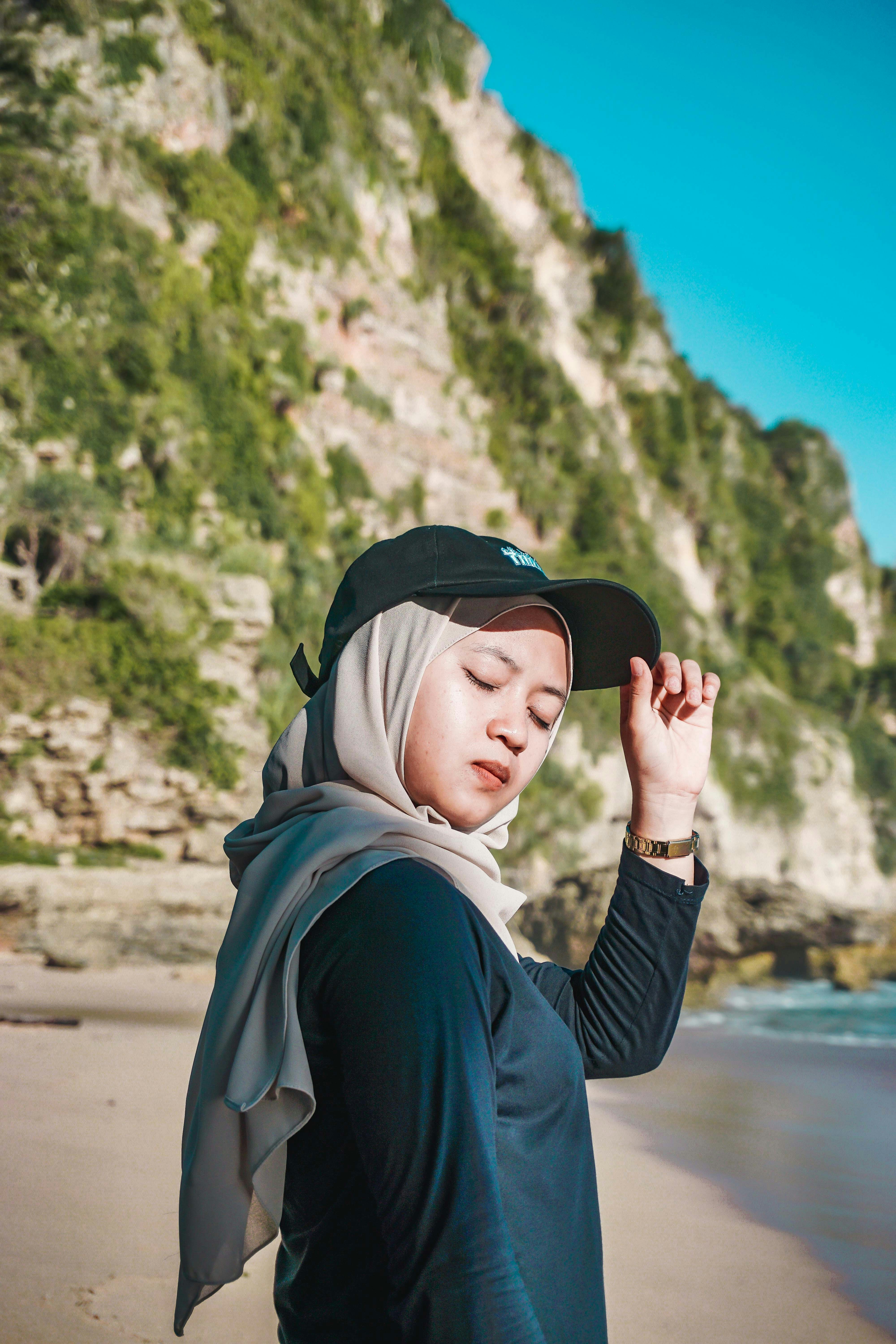 woman in black long sleeve shirt and white hijab