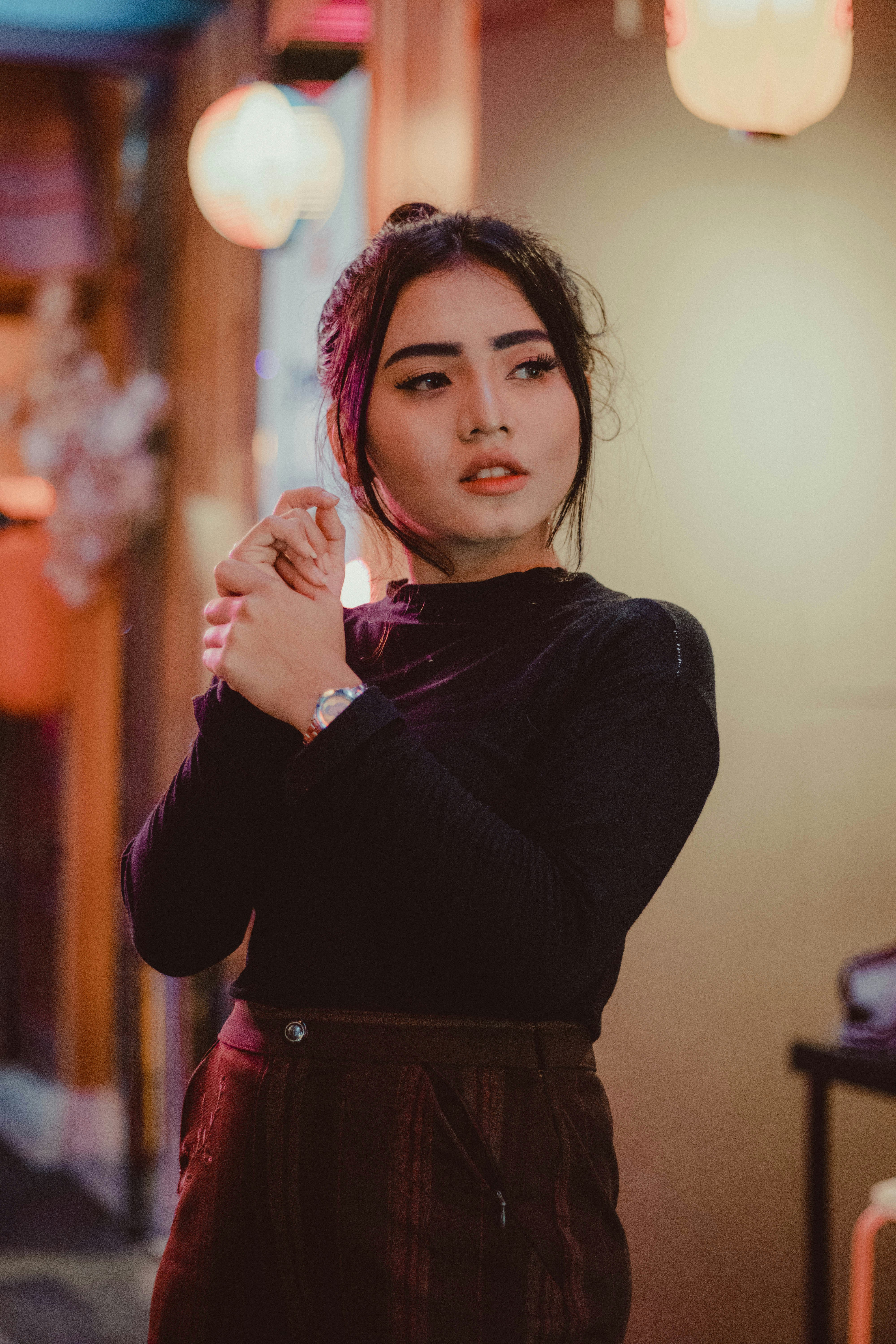 Woman in black long sleeved shirt and brown skirt photo Free West