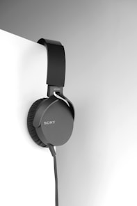 black and gray corded headphones