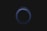 A circular pattern, resembling a vortex or swirling effect, is depicted against a dark background. The circle is composed of thin, semi-transparent lines with varying shades of blue.